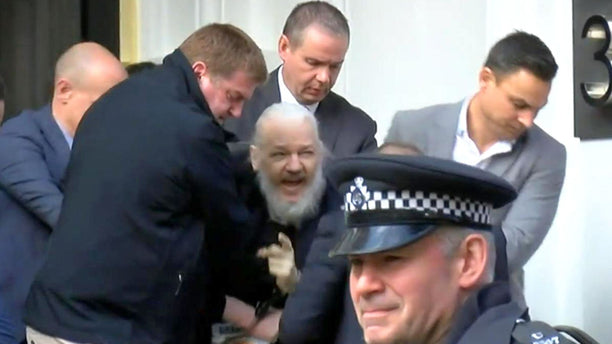 Julian Assange Outside the Gate of Hell