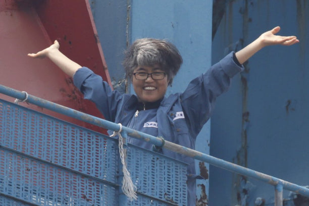 Kim Jin-suk, during a live-in protest at the top of a construction crane, 2011. (Photo: REUTERS)