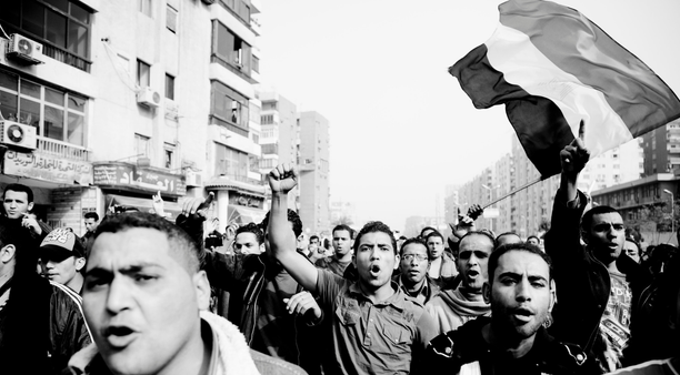 Black and white Anti-Mubarak protesters march through Nasr City, east Cairo, 29 January 2011. Photo by Hossam el-Hamalawy.