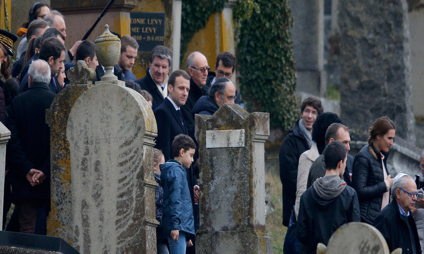 Emmanuel Macron visits a Jewish cemetery in Quatzenheim after an antisemitic attack in February 2019. 