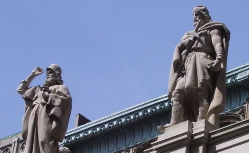 Two statues atop the Appellate Division Courthouse of New York State, First Department. via Wikimedia Commons.