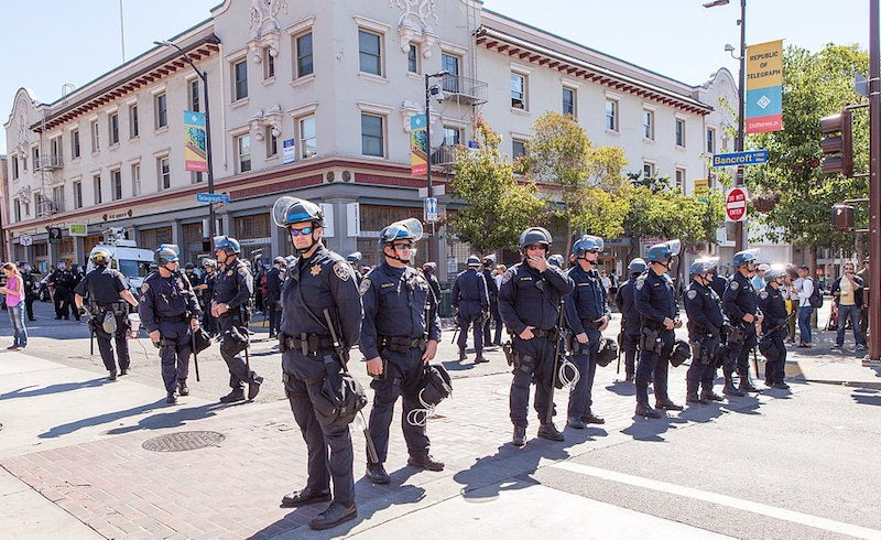 Free Speech Week: Police fill the intersection at Bancroft Way and Telegraph Avenue outside UC Berkeley. Photo: Pax Ahimsa Gethen. via Wikimedia Commons.