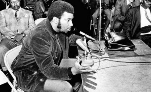 Fred Hampton Sr. addresses a public meeting.