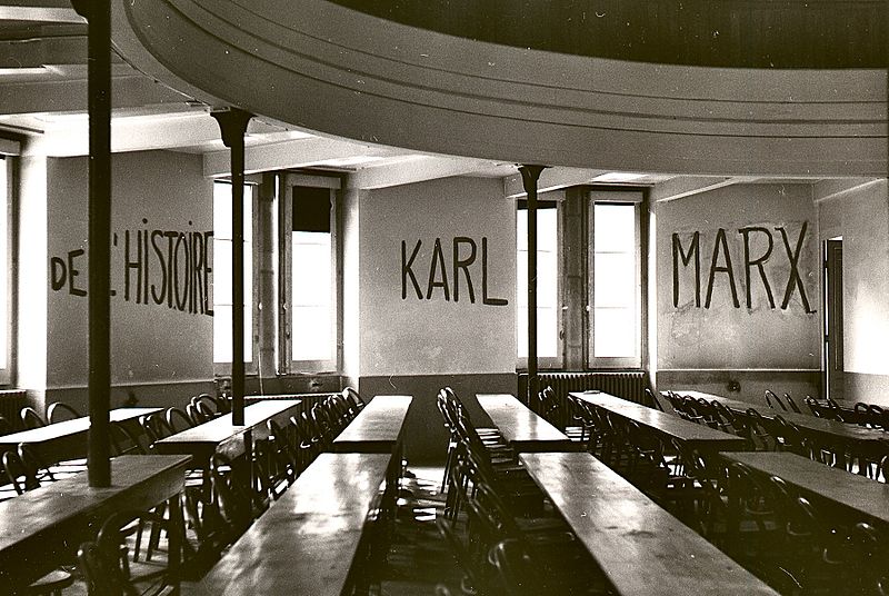 Classroom at the University of Lyon with markings on wall reading "DE L'HISTOIRE KARL MARX," May 1968. Photo credit: George Garrigues
