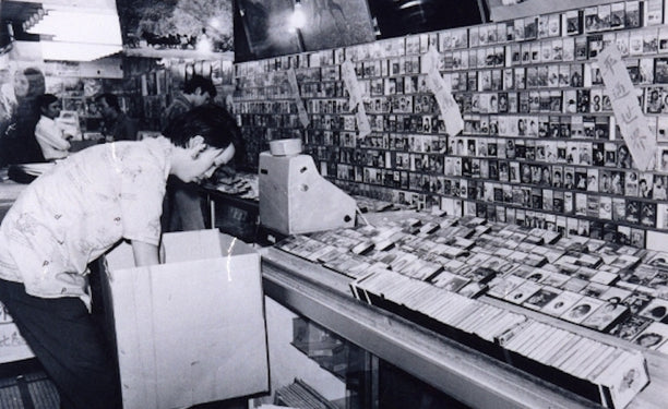 A shop in Hong Kong raided for selling pirated cassette tapes, 1974. 