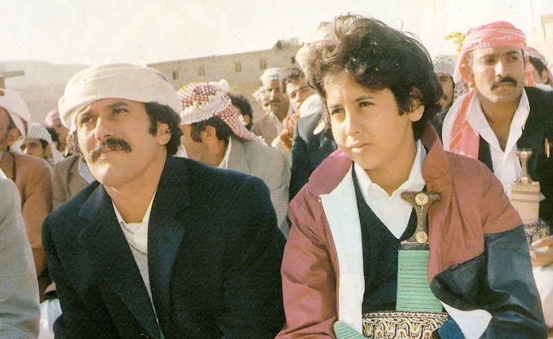 Ali Abdullah Saleh, with his son Ahmed, 1984. via Wikimedia Commons.