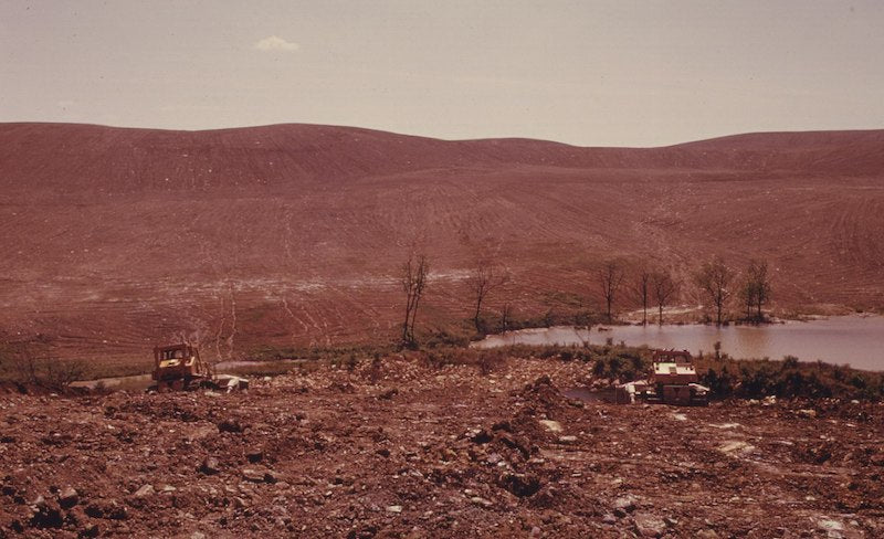 Strip mined land being recontoured by coal companies, Morristown, Ohio, 1974. Photo: Erik Calonius. via Wikimedia Commons.