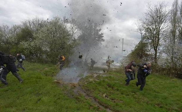 Zadistes flee a police grenade. via the Nantes Révoltée Facebook page.