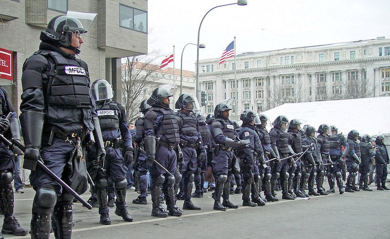 Riot police on the parade route for the second George W. Bush inauguration, Washington D.C., 2005. via Wikimedia Commons. 