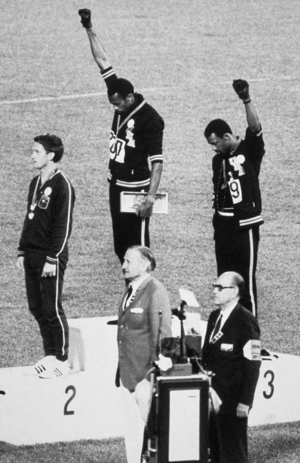 John Carlos and Tommie Smith raise their fists in protest during their medal ceremony at the 1968 Summer Olympics in Mexico City